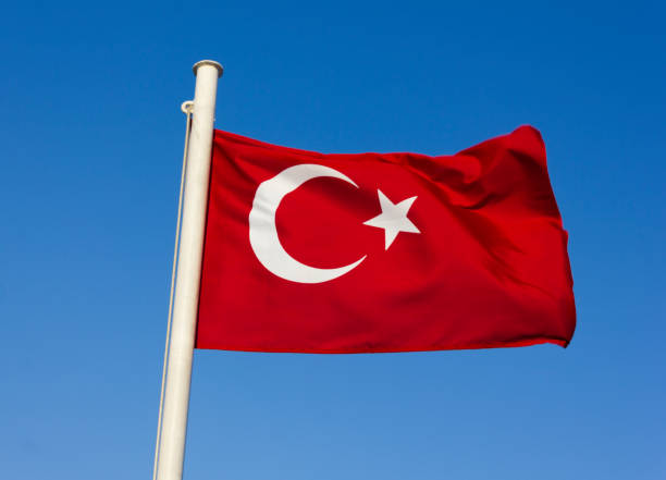 istock Waving flag of Turkey under sunny blue sky 816293096