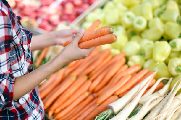 istock Woman buying vegetables 816311108