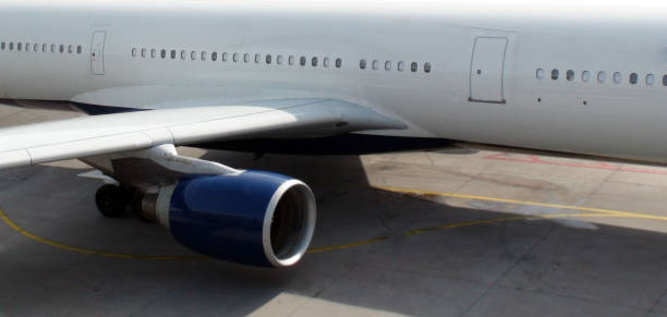 istock Scenery Of Airplane Wing,Engine,Window And Tire At Airport Loading,Unloading Gate 816311456