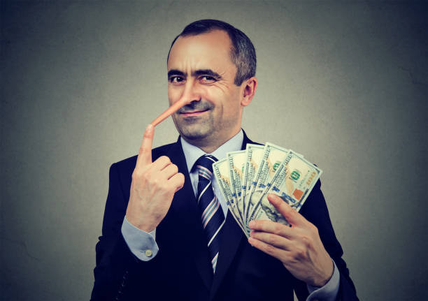 Financial fraud concept. Liar businessman with dollar cash Financial fraud concept. Liar businessman with dollar cash ponzi scheme stock pictures, royalty-free photos & images