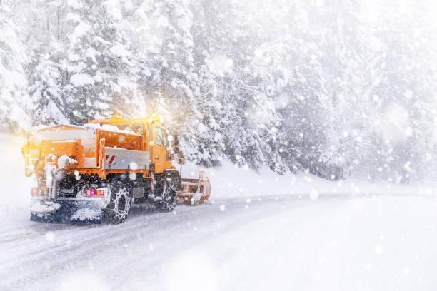 istock Snowing on icy road 816314776