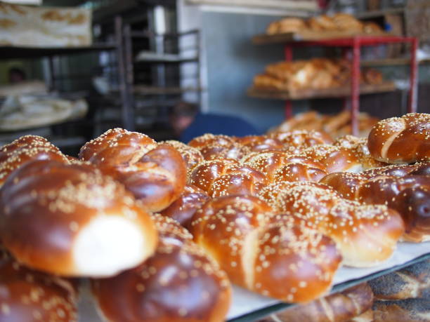 Fresh Challah from the Bakery Fresh challah baked in a Jerusalem bakery ready for Shabbat dinner. judiaca stock pictures, royalty-free photos & images