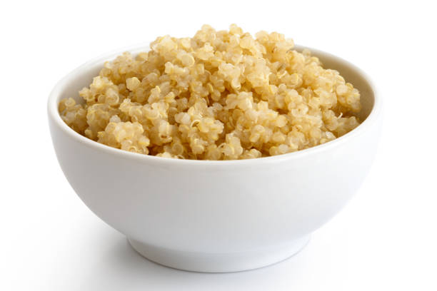 istock Cooked quinoa in white ceramic bowl isolated on white. 816324506