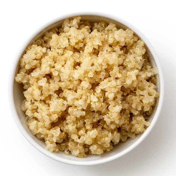 istock Cooked quinoa in white ceramic bowl isolated on white from above. 816325114