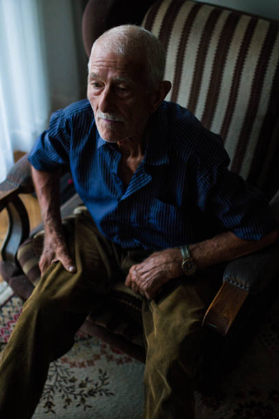 istock Serious senior man watch TV 816341780