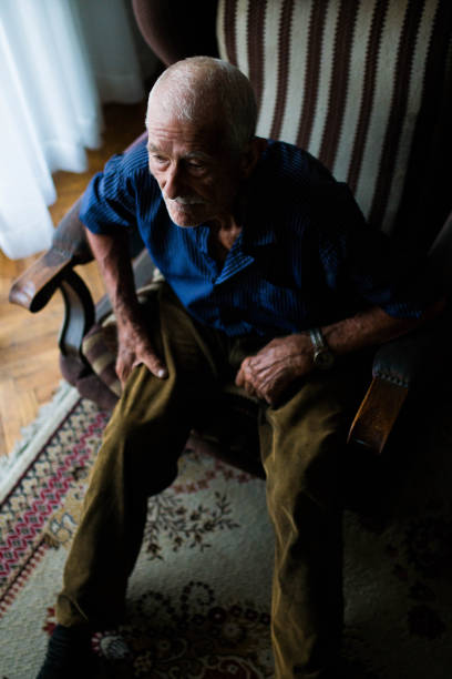 istock Serious senior man watch TV 816341798