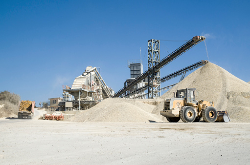 Several working belt conveyors and a piles of rubble in Gravel Quarry