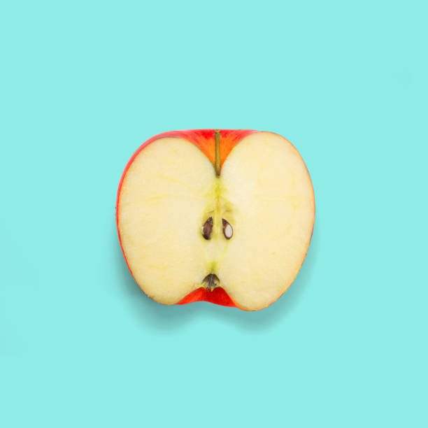 istock Half apple on blue background. Minimal concept. Pop color. Top view. 816352046
