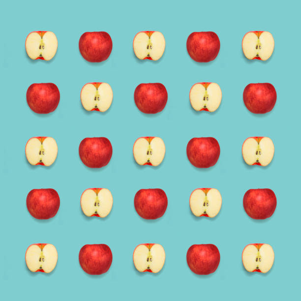 istock apples pattern on blue background. Minimal concept. Pop color. Top view. 816354336