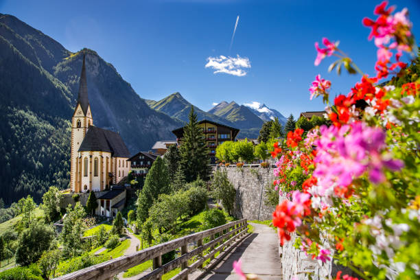Heiligenblut Church of Heiligenblut in carinthia in front of the beautiful Großglockner, Austria grossglockner stock pictures, royalty-free photos & images
