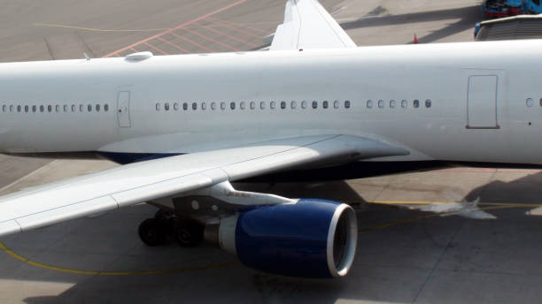 istock Aircraft Window,Wing,Engine And Tire Close Up View At Airport Loading,Unloading Gate 816371876