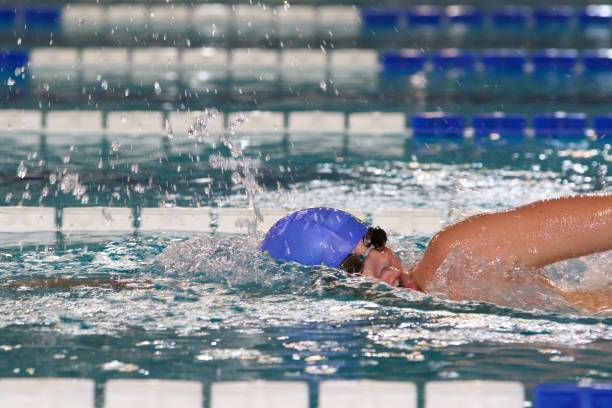 istock Young Boy competing in freestyle swimming race 816378506