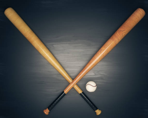 istock Baseball equipment on dark wooden table 816386280