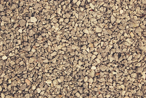 Gravel Stone Texture Background with a mix of grey and brown small pebbles