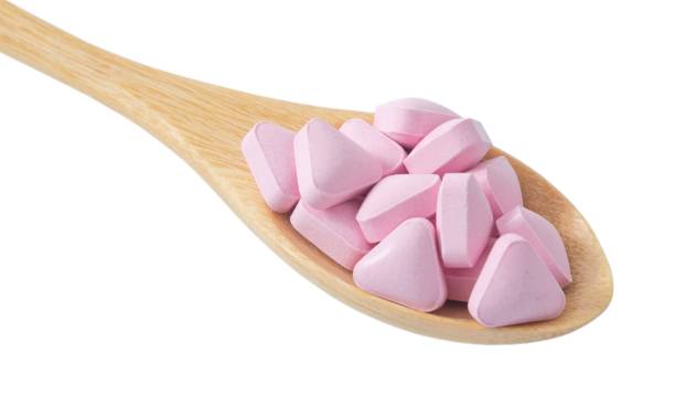 istock Wooden Spoon Full of Vitamins on White Background 816420714