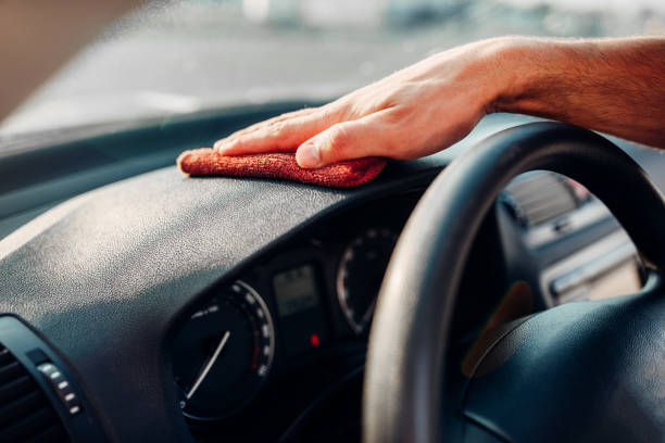 istock Male hands cleans auto, car dashboard polishing 816443660