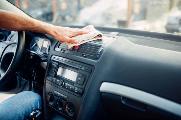 istock Male hands cleans auto, car dashboard polishing 816446200