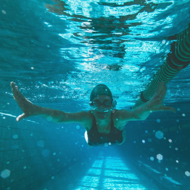 istock Athletic swimmer swimming towards camera 816461006