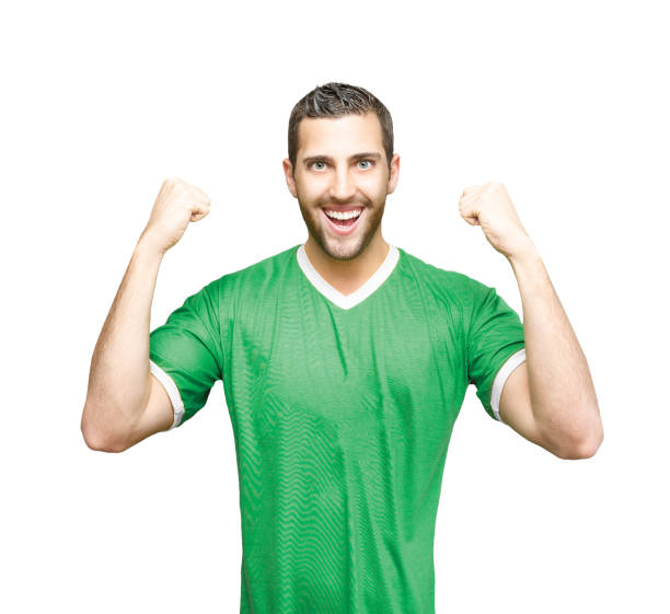 istock Fan / Sport Player on green uniform celebrating 816466448