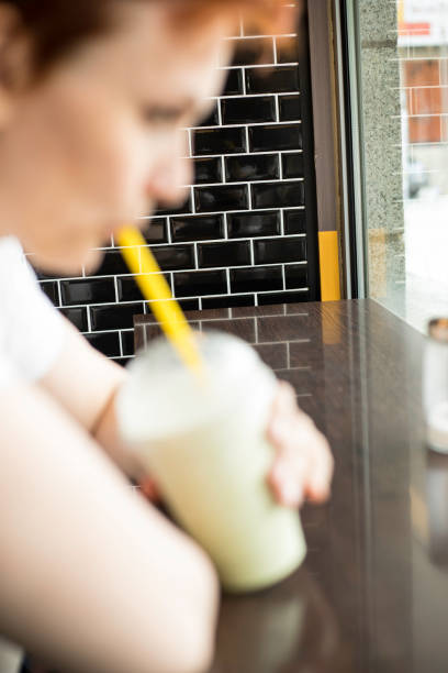 istock woman in a cafe 816497750