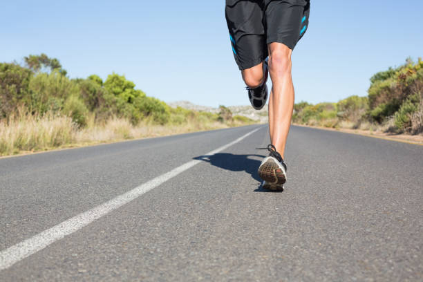 istock Fit man jogging on the open road 816500842