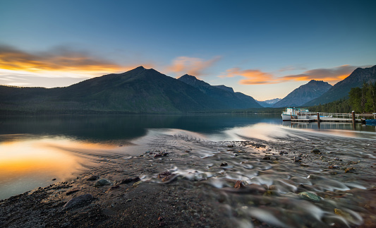 Scenic sunset over Vermilion Lake and Mount Rundle in Banff National Park, Alberta, Canada. Long exposure.