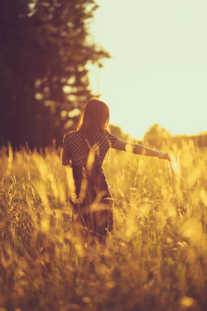 istock women in the evening sky in a meadow 816525992