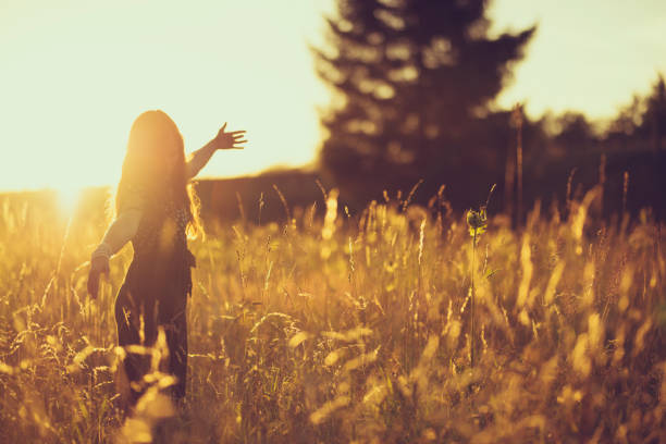 istock women in the evening sky in a meadow 816532948