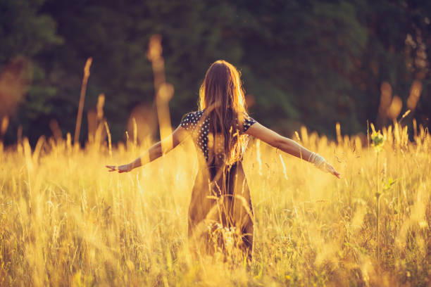 istock women in the evening sky in a meadow 816535620