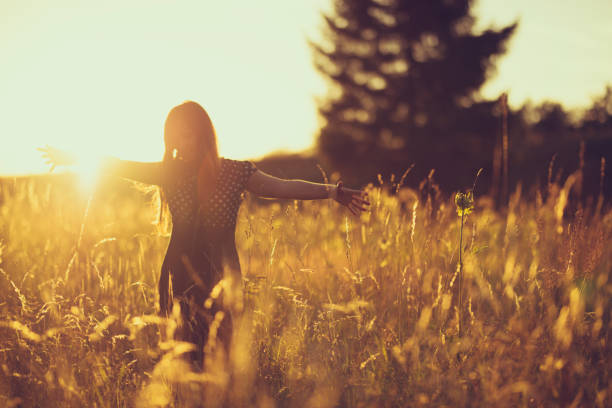 istock women in the evening sky in a meadow 816538106