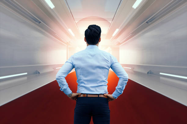 istock Businessman standing in corridor 816549660