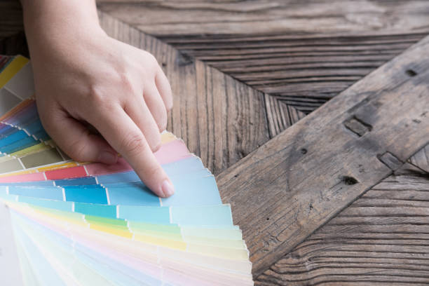 istock graphic or interior designer choosing a colour from color swatch sampler or catalogue palette guide 816556102