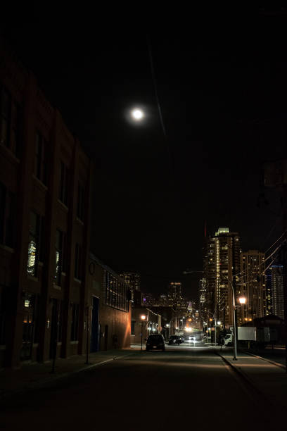 istock Dark City Street at Night with Moon 816564340