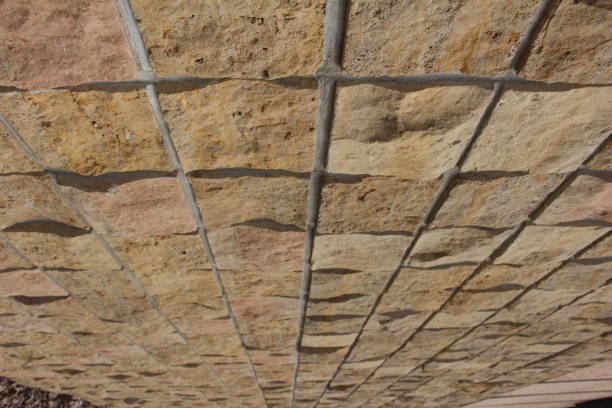 istock Closeup Angled View of Square Limestone Brick Wall 816580782