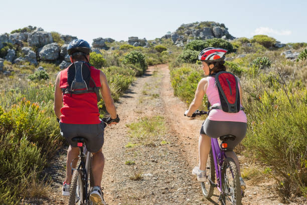 istock Active couple cycling in the countryside 816607904