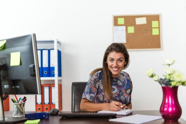 istock Businesswoman taking a note in her office 816630904