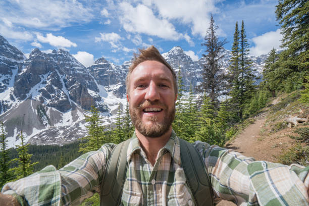 istock Hiker capturing selfie on mountain trail 816638330