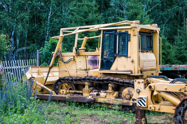 istock Yellow bulldozer in the forest 816643516