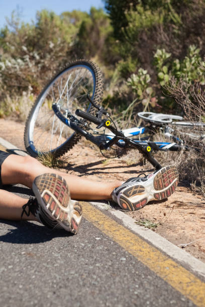 istock Cyclist lying on the road after an accident 816682538