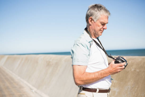 istock Happy senior man looking at his camera 816687198