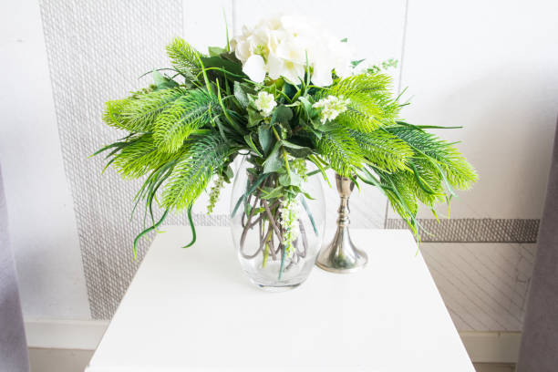 istock Decoration artificial flower in jar on wood table 816687424