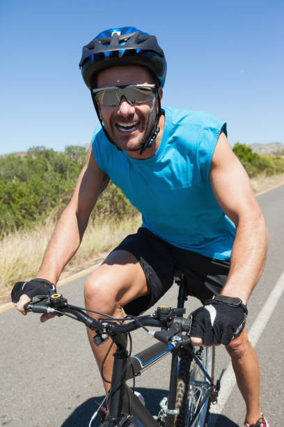 istock Smiling cyclist riding on the open road 816689532