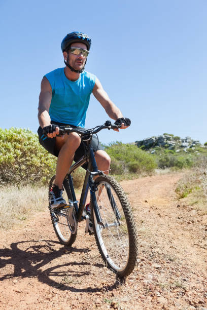 istock Fit cyclist riding on country trail 816689640