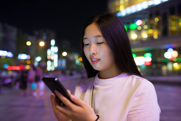 istock Close-up man with smart phone at night 816696834