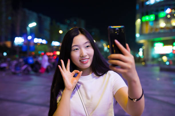 istock Close-up man with smart phone at night 816697006