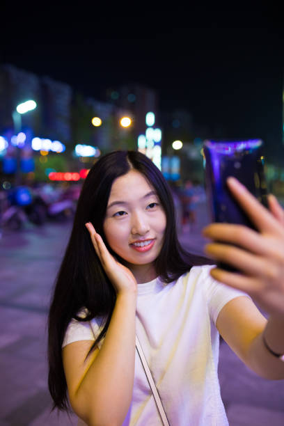 istock Close-up man with smart phone at night 816697092