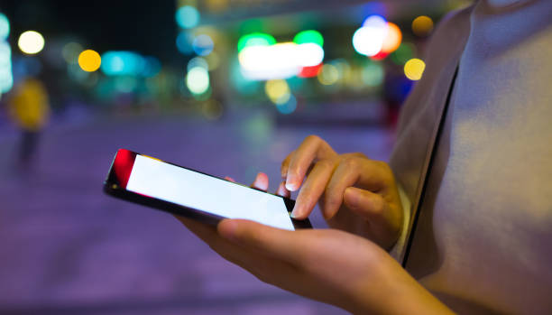 istock Close-up man with smart phone at night 816701462