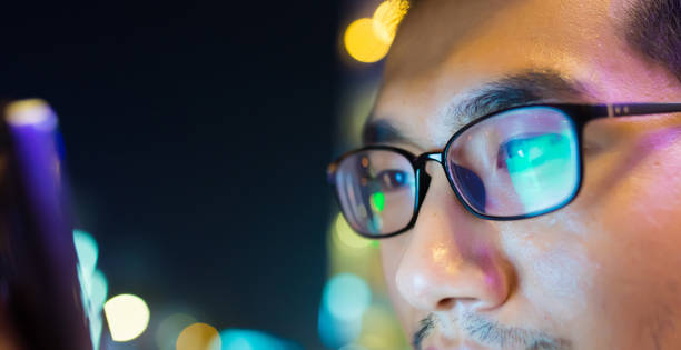 istock Close-up man with smart phone at night 816701682