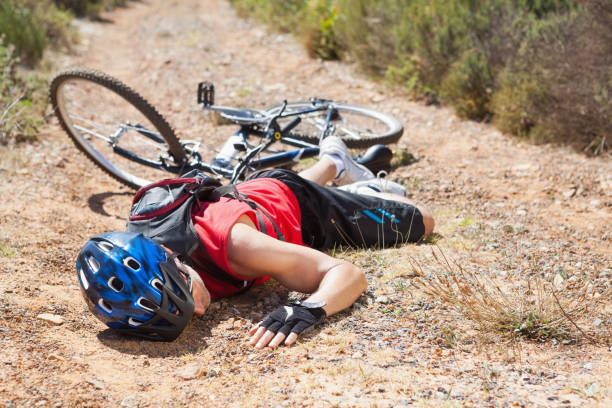 istock Injured cyclist lying on ground after a crash 816709140