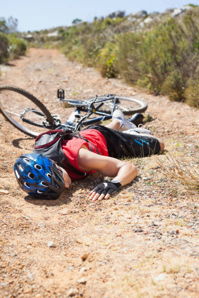 istock Injured cyclist lying on ground after a crash 816709252